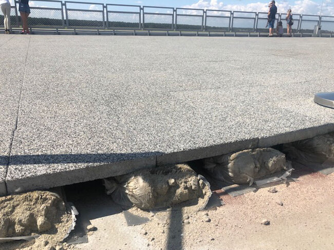 Granite terrace on raised deck supported on sandbags