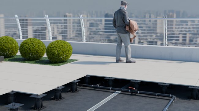 cutaway view of an elevated rooftop terrace with a man stand