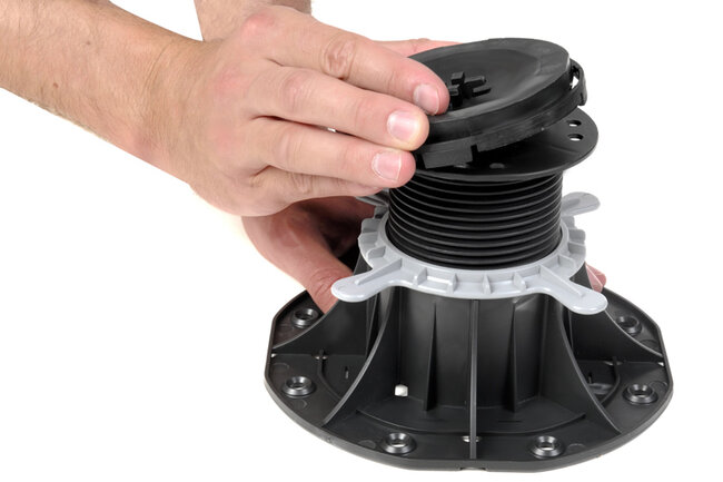 adjusting an adjustable plastic pedestal riser for decking o