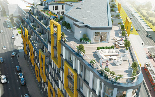 Conception moderne d'un bâtiment commercial et résidentiel avec une grande terrasse sur toit et une terrasse en dalles.