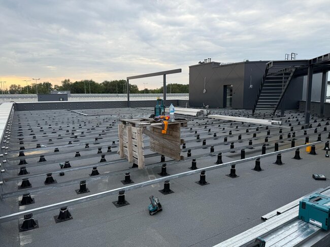 rooftop deck under construction with adjustable pedestals me